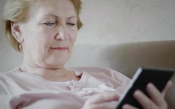 Free Stock Video Senior Woman Looking At Reading Device