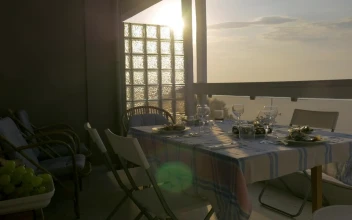 Free Stock Video Serving A Family Dinner On The Balcony