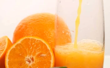 Free Stock Video Serving Juice In A Glass With Some Oranges On A