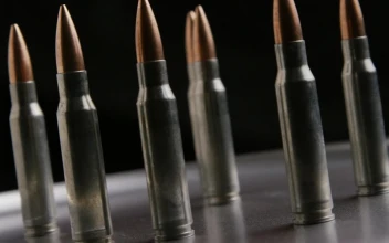 Free Stock Video Several Bullets Rotating On A Metal Plate