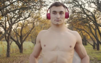 Free Stock Video Shirtless Man In Headphones Flexes Muscles Before Outdoor Workout