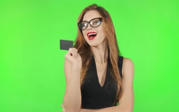 Free Stock Video Shopping Model Poses With Credit Card On Greenscreen