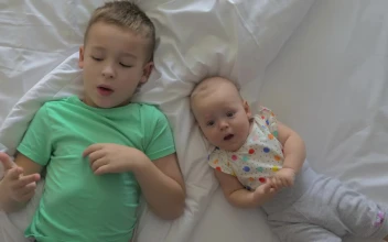 Free Stock Video Siblings Laying Down On A Bed