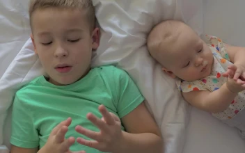 Free Stock Video Siblings Laying On A Bed