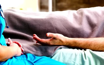 Free Stock Video Sick Man On Bed Comforted By Nurse Holding Hands