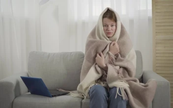 Free Stock Video Sick Woman Sneezes On Sofa While Wrapped In Blanket