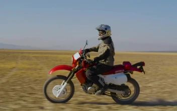 Free Stock Video Side Shot Of A Biker In The Desert