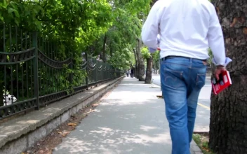 Free Stock Video Sidewalk In A City With A Couple Of People Walking