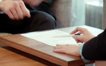 Free Stock Video Signing On A Contract On A Wooden Table