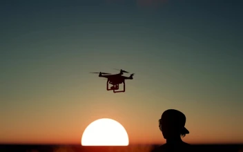 Free Stock Video Silhouette Of A Boy Flying A Drone At Sunset