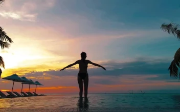 Free Stock Video Silhouette Of A Woman Doing Yoga In Hotel Pool