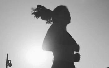 Free Stock Video Silhouette Of A Young Woman Jogging In Front Of The