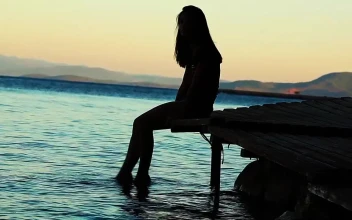 Free Stock Video Silhouette Of Woman Putting Her Feet Into The Sea