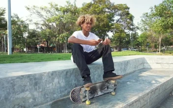 Free Video Stock Skater Sitting In A Park Listening To Music