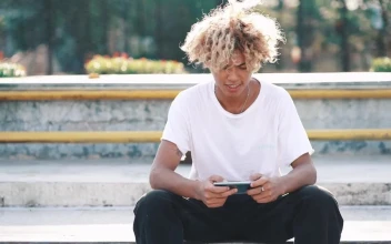 Free Video Stock Skater Texting And Looking At The Camera