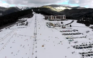 Free Video Stock Ski Resort And Skiers Going Down The Mountain