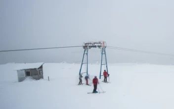 Free Video Stock Skiers On A Misty Snowy Mountain