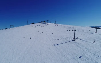 Free Video Stock Skiers On A Practice Mountain Aerial View