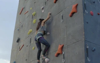 Free Video Stock Skillful Woman Climbing A High Wall For Mountaineering