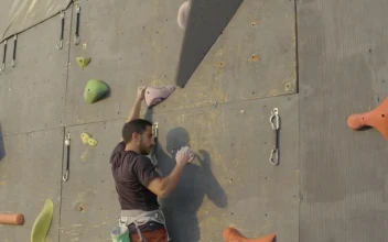 Free Video Stock Skillfully Climbing To The Top Of A Large Mountaineering Wall  Large