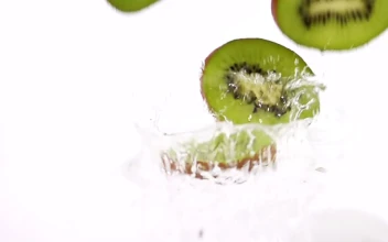 Free Video Stock Slices Of Kiwi Falling Into Water