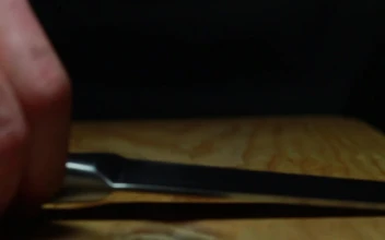 Free Video Stock Slicing A Tomato Over A Chopping Board