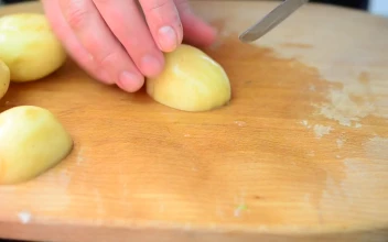 Free Video Stock Slicing Raw Potatoes On A Table