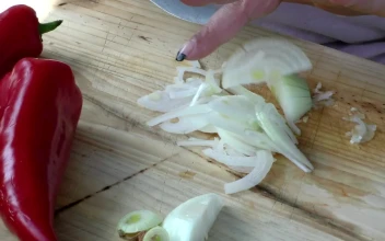 Free Video Stock Slicing Vegetables On A Wooden Board
