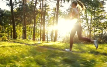 Free Video Stock Slim Runner Running Against The Light In The Park