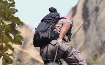 Free Video Stock Slowly Descending From A Mountain With A Harness