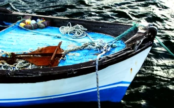 Free Video Stock Small Anchored Fishing Boat Seen In Detail