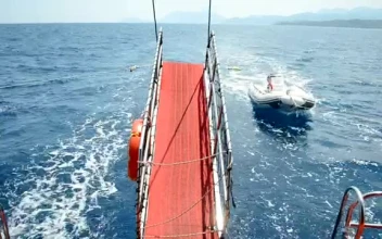 Free Video Stock Small Boat Behind A Large Yacht