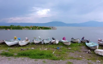 Free Video Stock Small Boats On The Shore Of A Huge Lake