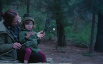 Free Video Stock Small Family Eating Roasted Marshmallows In Nature