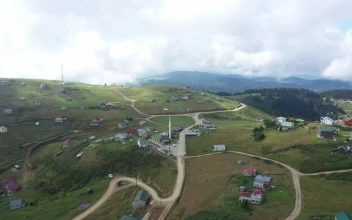 Free Video Stock Small Town Across A Cloudy Hill