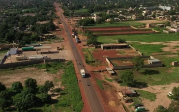 Free Video Stock Small Village In Mali With Traffic Heading Through