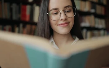 Free Video Stock Smart Girl Thinking While Reading Book
