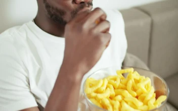 Free Video Stock Smiling Man Watches Movie And Eats Snacks
