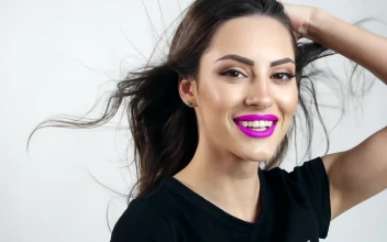 Free Video Stock Smiling Model In Purple Lipstick On White Background