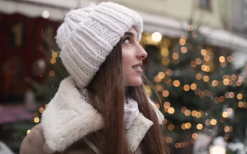 Free Video Stock Smiling Woman Enjoys Winter Snowflakes In Street