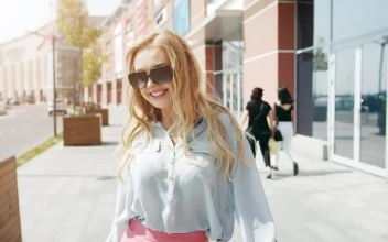 Free Video Stock Smiling Woman Spins Outside Shopping Mall