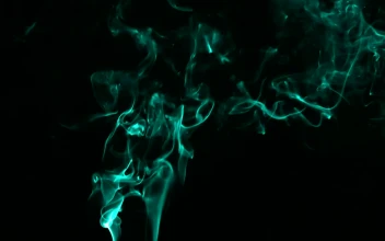 Free Video Stock Smoke With Fluorescent Particles On Black Background