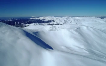 Free Video Stock Smooth Texture Of Snow Over Mountains