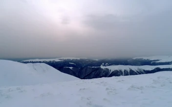 Free Video Stock Snow Filled Flat Surface Of The Top Of A Mountain