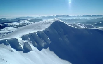 Free Video Stock Snowy Hill In A Mountain Range