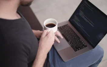 Free Video Stock Software Developer Holding A Coffee Cup