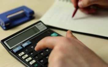 Free Video Stock Solving Accounts In A Notebook With A Calculator