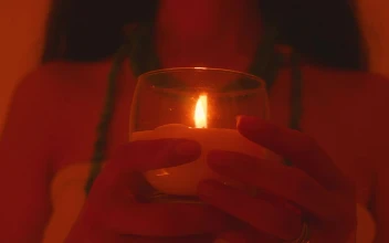 Free Video Stock Spiritual Girl Holding A Candle In Her Hands