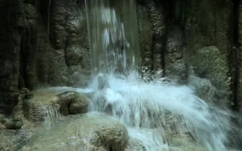 Free Video Stock Splashing At The Base Of A Waterfall