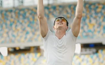 Free Video Stock Sports Race Winner Raises Hands In Victory